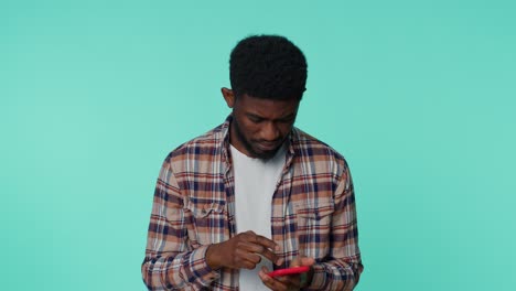 African-american-man-use-mobile-phone-typing-post-sms-message-browsing-addiction-of-social-networks