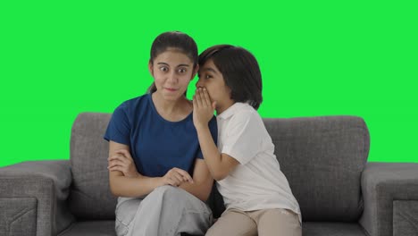 Indian-brother-telling-a-secret-to-his-sister-Green-screen