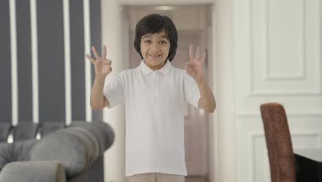 Happy-Indian-boy-showing-okay-sign