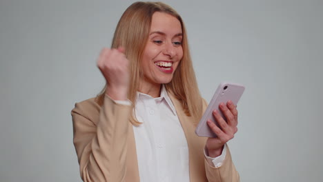 Happy-excited-woman-use-smartphone-say-wow-yes-found-out-great-big-win-news-doing-winner-gesture