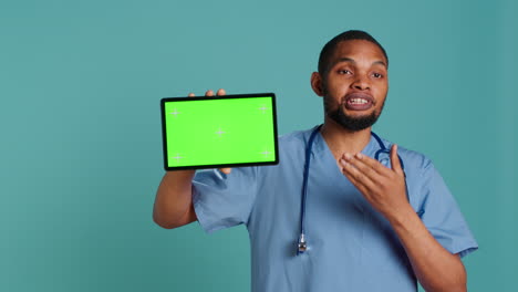 Healthcare-worker-holding-mockup-digital-device