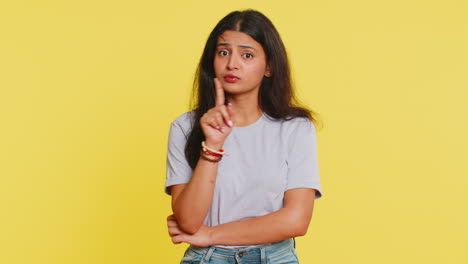 Indian-woman-presses-finger-to-lips-make-silence-gesture-sign-don't-tells-secret-stop-gossip-privacy