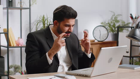 Business-man-winner-working-browsing-typing-on-laptop-at-office-celebrate-big-lottery-win-good-news