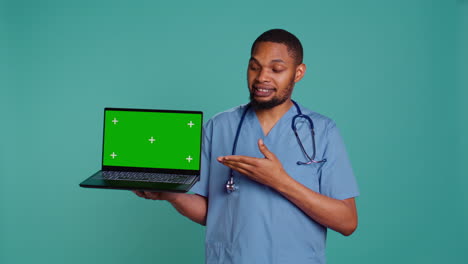 Hospital-staff-member-doing-presentation-using-chroma-key-notebook