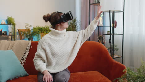 Woman-using-virtual-reality-futuristic-technology-headset-to-play-simulation-3D-video-game-at-home