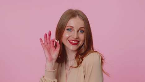 Positive-businesswoman-girl-showing-ok-gesture,-like-sign-positive-something-good-on-pink-background