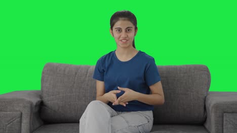 Happy-Indian-teenage-girl-talking-to-the-camera-Green-screen