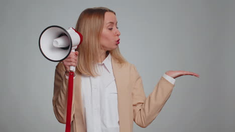 Woman-talking-with-megaphone,-proclaiming-news,-loudly-announcing-advertisement-pointing-empty-place