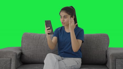 Angry-Indian-teenage-girl-shouting-on-video-call-Green-screen