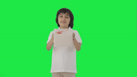 Happy-Indian-boy-giving-a-gift-Green-screen