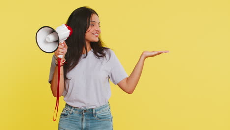 Indian-woman-talking-with-megaphone,-proclaiming-news-loudly-announcing-advertisement-discounts-sale