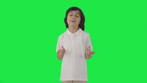 Happy-Indian-boy-talking-to-the-camera-Green-screen