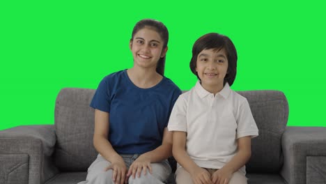 Happy-Indian-sibling-talking-to-the-camera-Green-screen