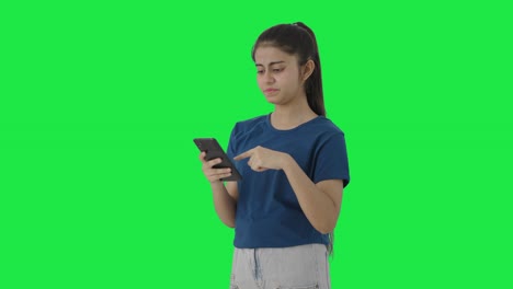 Lazy-Indian-teenage-girl-scrolling-phone-Green-screen