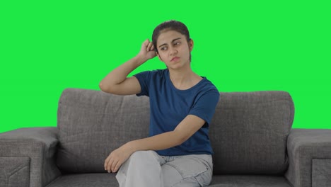 Confused-Indian-teenage-girl-thinking-about-something-Green-screen