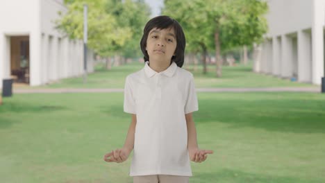 Indian-boy-asking-what-to-the-camera-in-park