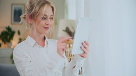 Businesswoman-Manages-Company-on-Tablet