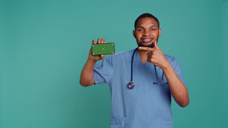 Radiant-healthcare-specialist-holding-chroma-key-phone