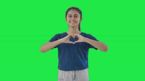 Happy-Indian-teenage-girl-making-heart-sign-Green-screen