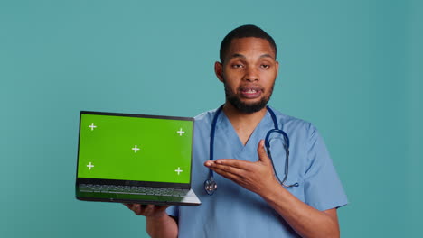 Nurse-showing-patient-treatment-plan-using-mockup-notebook