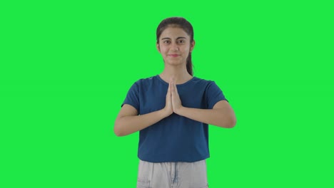 Happy-Indian-teenage-girl-doing-Namaste-Green-screen