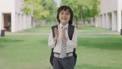 Happy-Indian-school-boy-clapping-and-appreciating