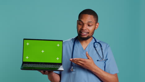 Hospital-staff-member-doing-presentation-using-chroma-key-notebook