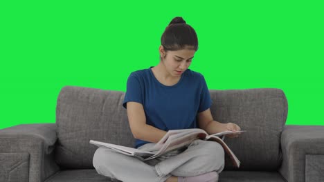 Stressed-Indian-teenage-girl-preparing-for-exams-in-a-rush-Green-screen