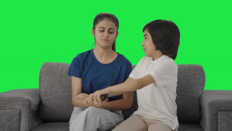 Indian-siblings-fighting-for-TV-remote-Green-screen