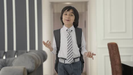 Happy-Indian-school-boy-talking-to-the-camera