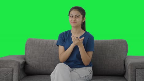 Happy-Indian-teenage-girl-clapping-and-appreciating-Green-screen