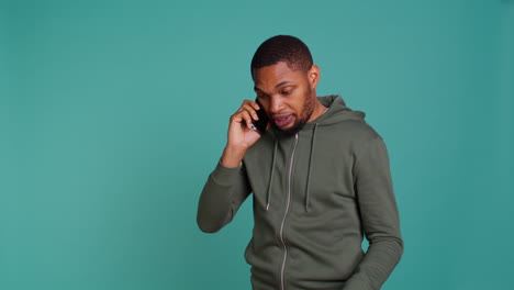 Irked-man-fighting-with-friends-during-telephone-call