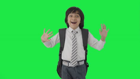 Happy-Indian-school-boy-saying-Hi-to-the-camera-Green-screen