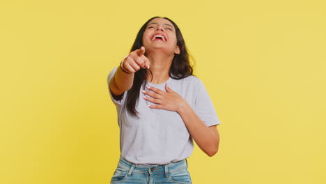 Happy-excited-Indian-woman-laughs-out-loud-after-hearing-ridiculous-anecdote,-reaction-on-funny-joke