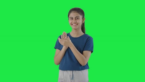 Happy-Indian-teenage-girl-clapping-and-appreciating-Green-screen