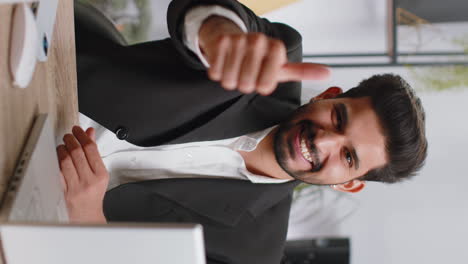 Happy-business-man-looking-approvingly-at-camera-showing-thumbs-up,-like-positive-sign,-good-news