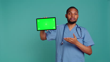 Healthcare-worker-holding-mockup-digital-device