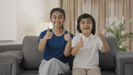 Indian-siblings-showing-thumbs-up-to-the-camera