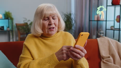 Sad-grandmother-woman-use-smartphone-surprised-by-bad-news-fortune-loss-fail-lottery-result-deadline