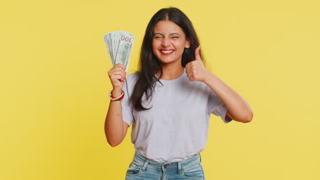 Rich-happy-Indian-woman-winner-waving-money-dollar-cash-like-a-fan,-income-wealth-success-business