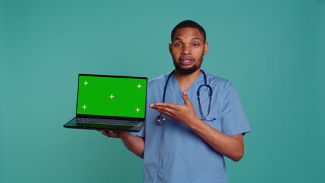 Nurse-showing-patient-treatment-plan-using-mockup-notebook