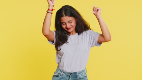 Happy-Indian-woman-listening-music-dancing-disco-having-fun-relaxing-on-party-making-funny-moves