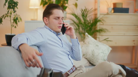Businessman-Comfortably-Talking-on-Phone