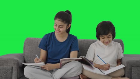 Happy-Indian-sibling-studying-at-home-Green-screen