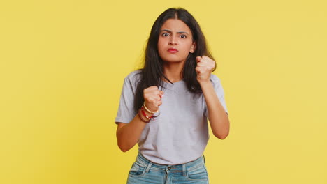 Aggressive-angry-Indian-woman-trying-to-fight-at-camera,-shaking-fist,-boxing,-punishment,-threaten