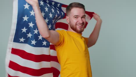 Man-waving,-wrapping-in-American-USA-flag,-celebrating,-human-rights,-freedoms,-Independence-Day