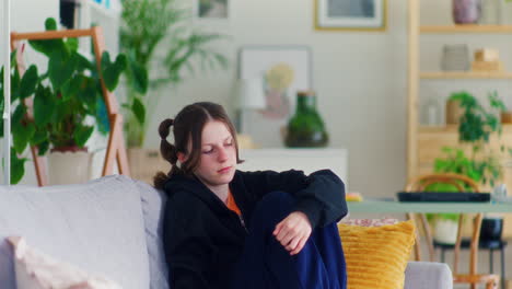 A-Pensive-Teenager-Uses-a-Smartphone-and-Browses-Social-Media