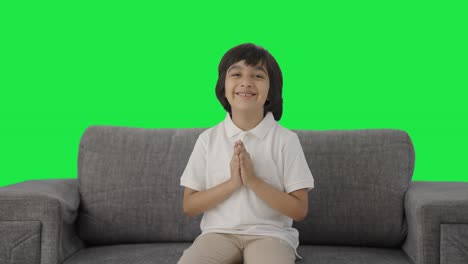 Cute-Indian-boy-doing-Namaste-and-greetings-Green-screen