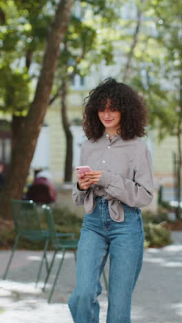 Tourist-traveler-young-woman-using-smartphone-typing-text-messages-looking-for-search-a-way-on-map