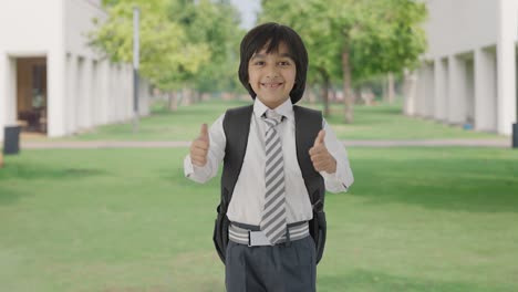 Happy-Indian-school-boy-showing-thumbs-up